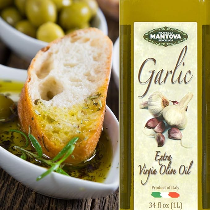 Mantova Garlic Extra Virgin Olive Oil (EVOO) Cold-Pressed and Imported from Italy 34 oz Glass Bottle - Flavorful Topping for Salads Vegetables and Pasta Dishes - Ideal for Dipping Italian Bread or