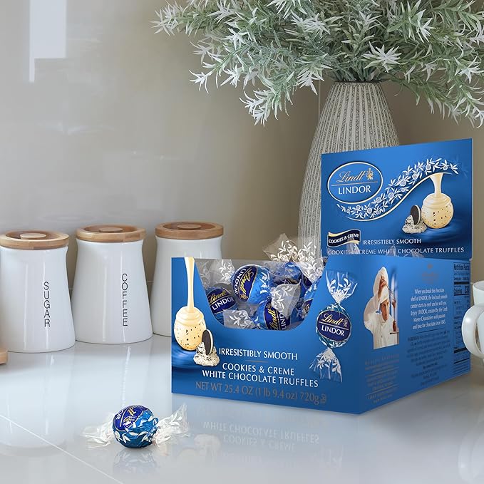 Lindt LINDOR Cookies and Creme White Chocolate Candy Truffles with Smooth Melting Truffle Center 25.4 oz. 60 Count
