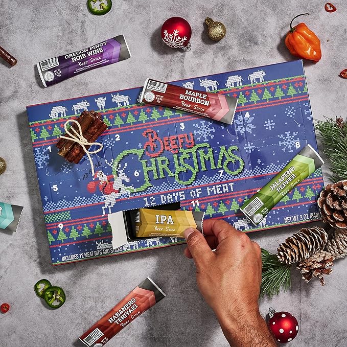 Man Crates 12 Days of Jerky Advent Calendar 2025 Featuring Ugly Christmas Sweater Artwork – Includes 12 Delicious Bites of Beef Jerky – Festive Flavors Like Habanero Maple Bourbon &amp More